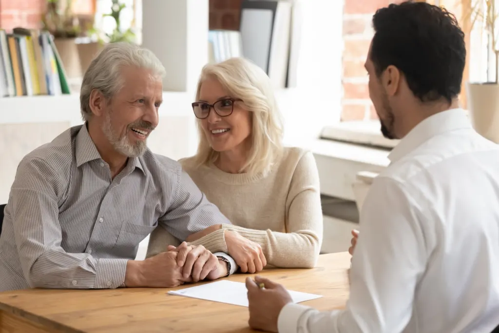 Homeowners going over a contract with a project specialist