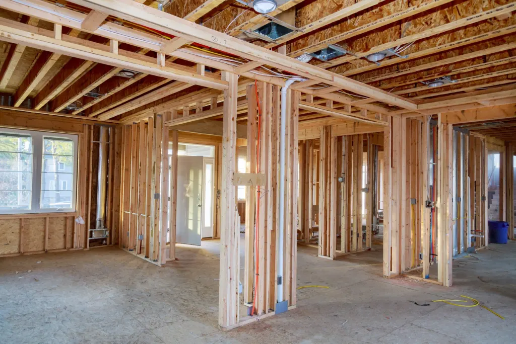 Plumbing and electrical rough-in inside framed walls