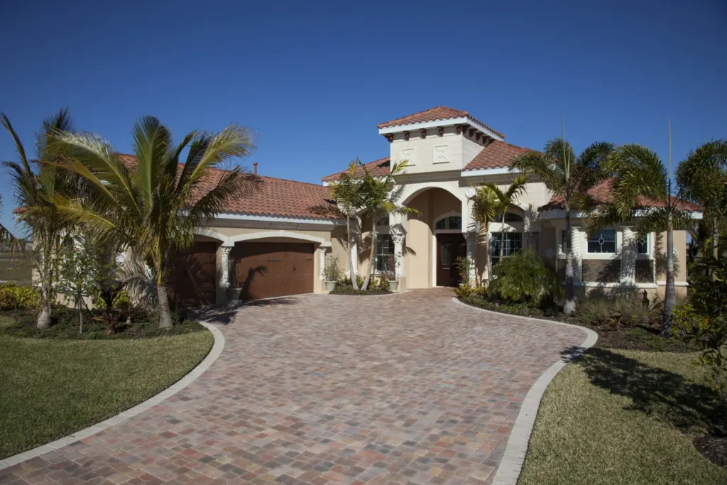 Paver driveway curving up to a Florida home