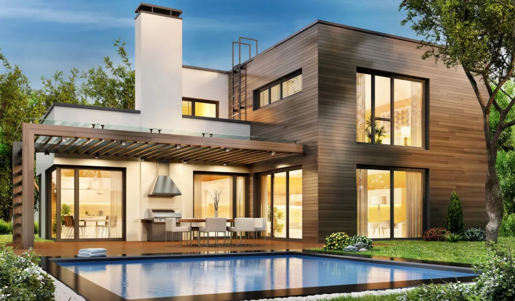 Freshly finished modern home exterior lit at dusk beside a pool