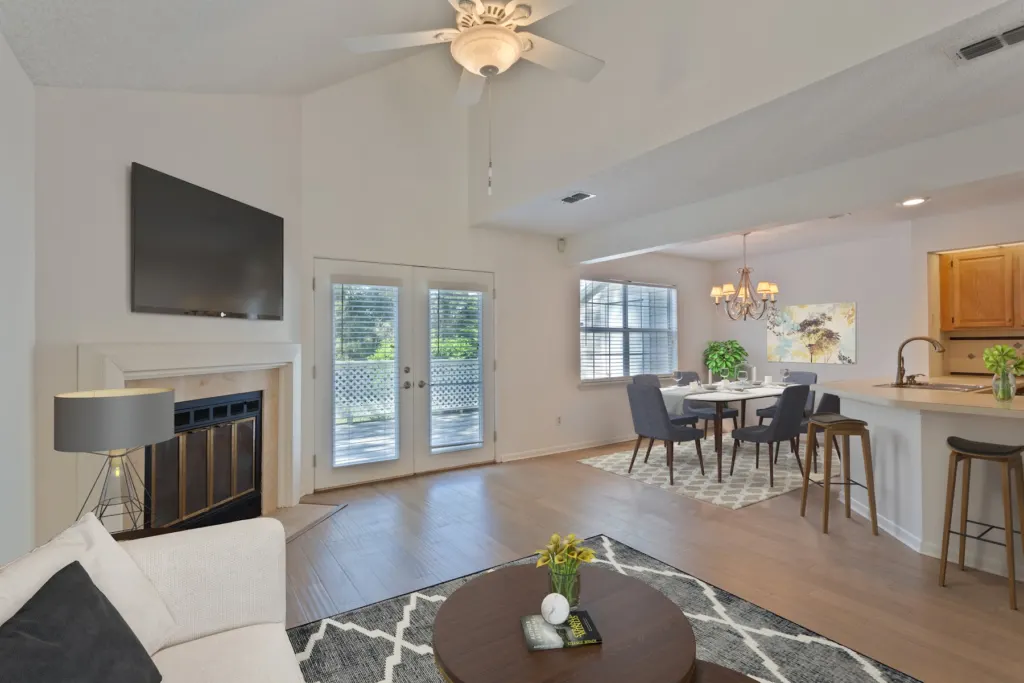 Open-plan living and dining area in a warm neutral finish