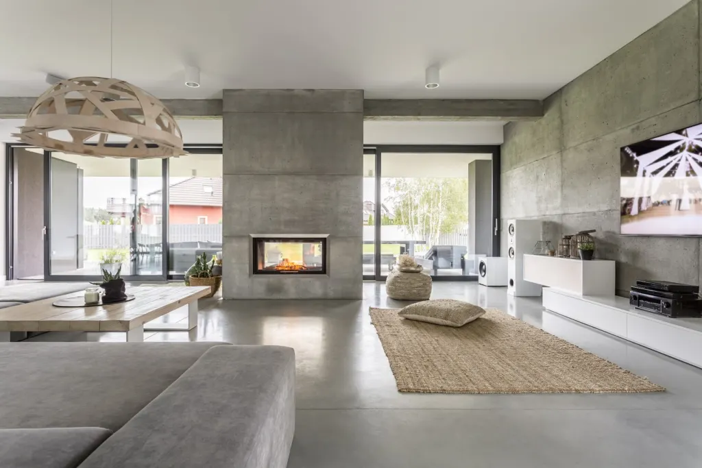 Contemporary living space with a polished concrete wall finish